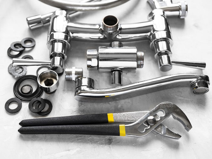 Chrome sink and hardware with plumbing tools